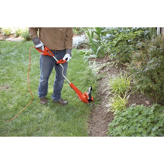 14 Inch Edger being used for edging lawn.